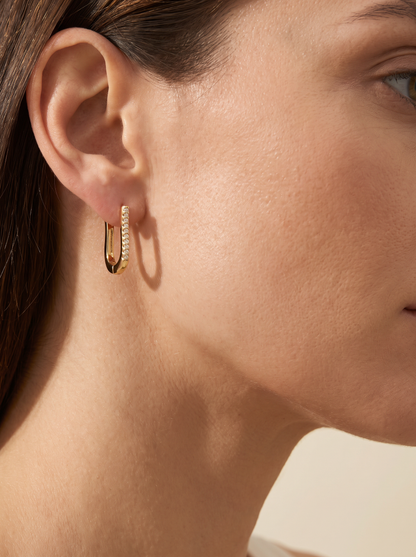 The Arc Earrings worn by model