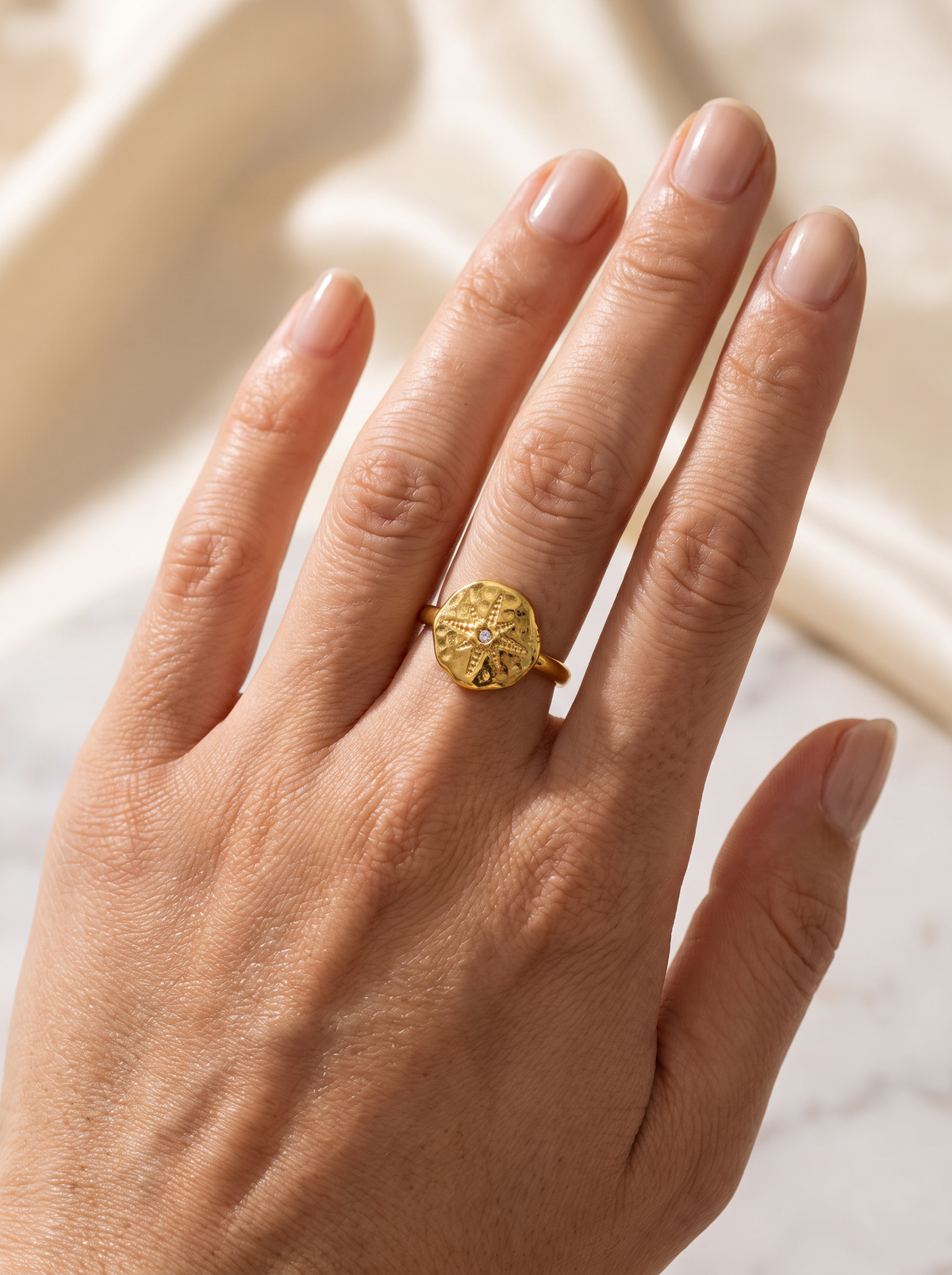 The Astra Ring worn on hand