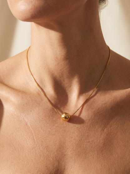 The Orbit Necklace worn by model
