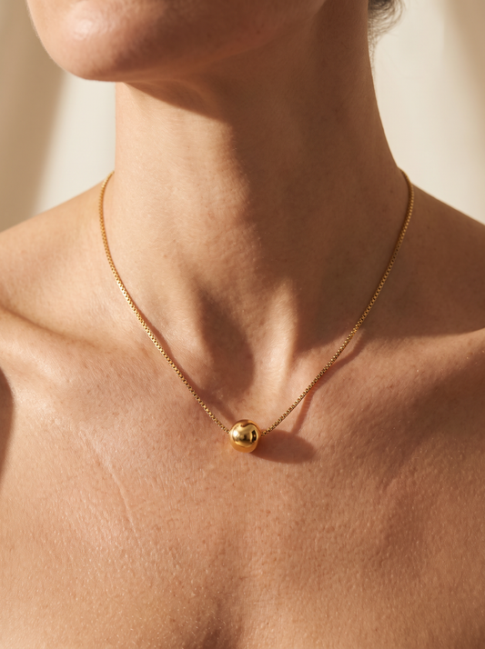 The Orbit Necklace worn by model